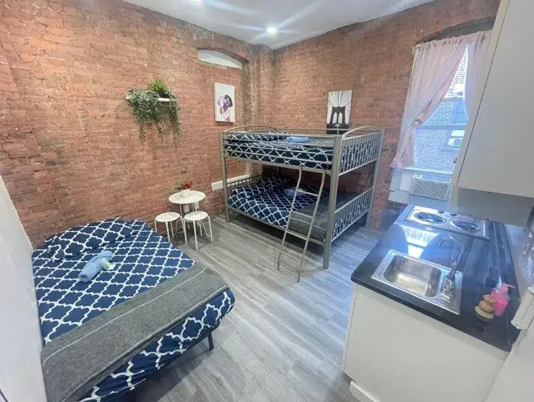 Private Studio with exposed brick, a bunk bed and a kitchen