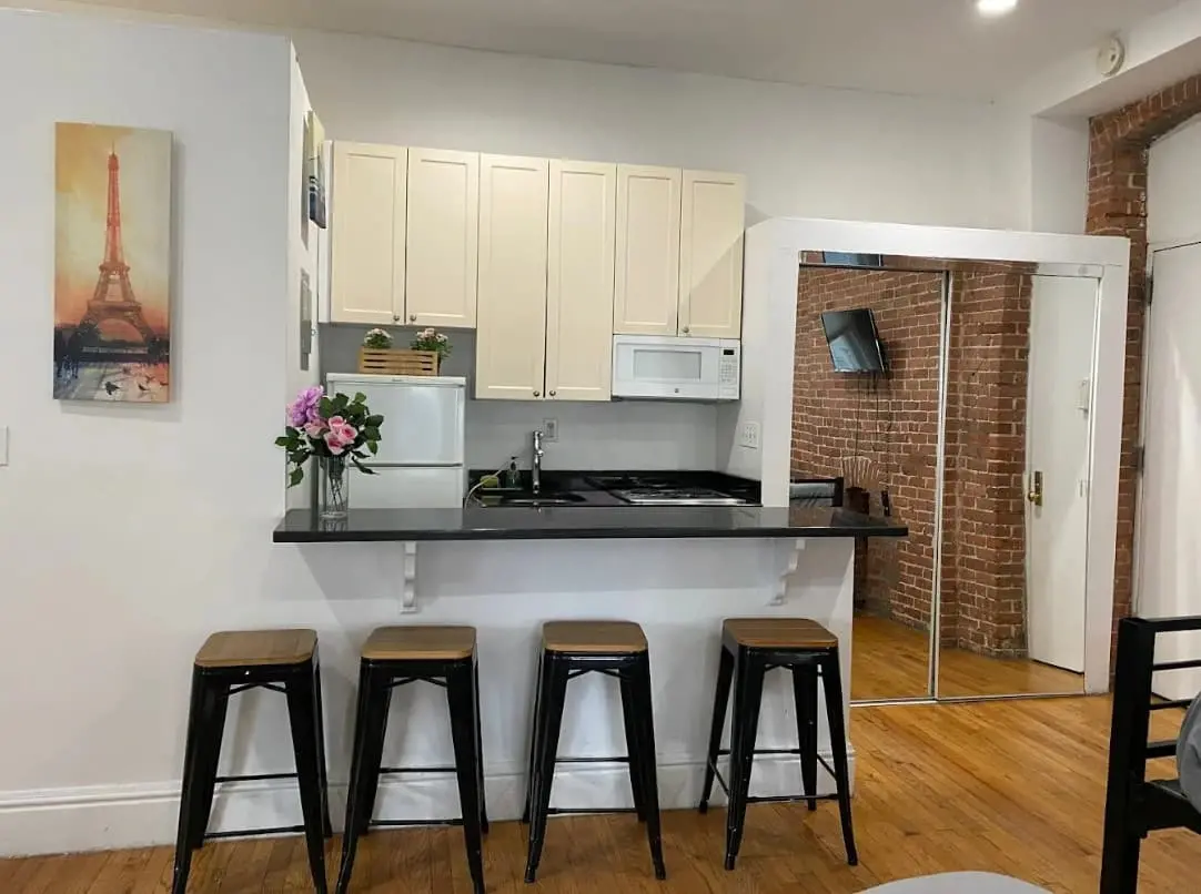 Kitchen with a breakfast bar and stools in an apartment